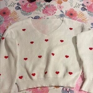 White Sweater with Red Heart Accents